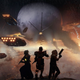 Destiny 2 Guardians look out over the Last City as the Cabal attack.